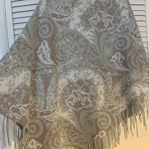 Silver, white, blue poncho with fringe.